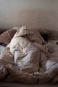 child sleeping covered with blanket