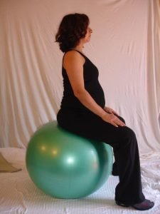 Pelvic tilts on birthing ball