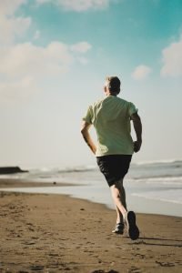 man running in the beach