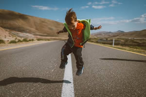 Little boy jumping happy because he has no skid marks in his underwear