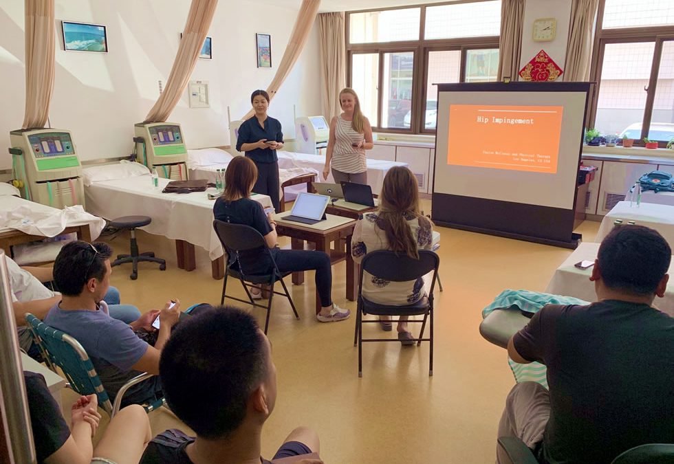 Heather returns from work with the Chinese Olympic Committee