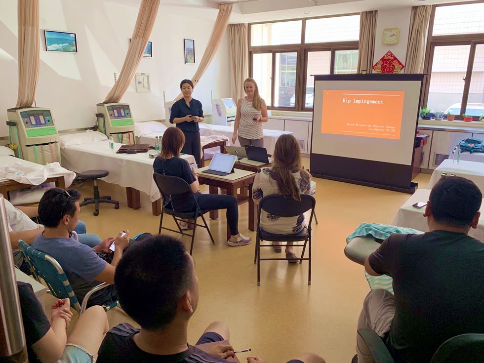 Heather returns from work with the Chinese Olympic Committee