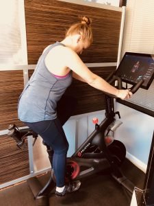 woman cycling in the gym